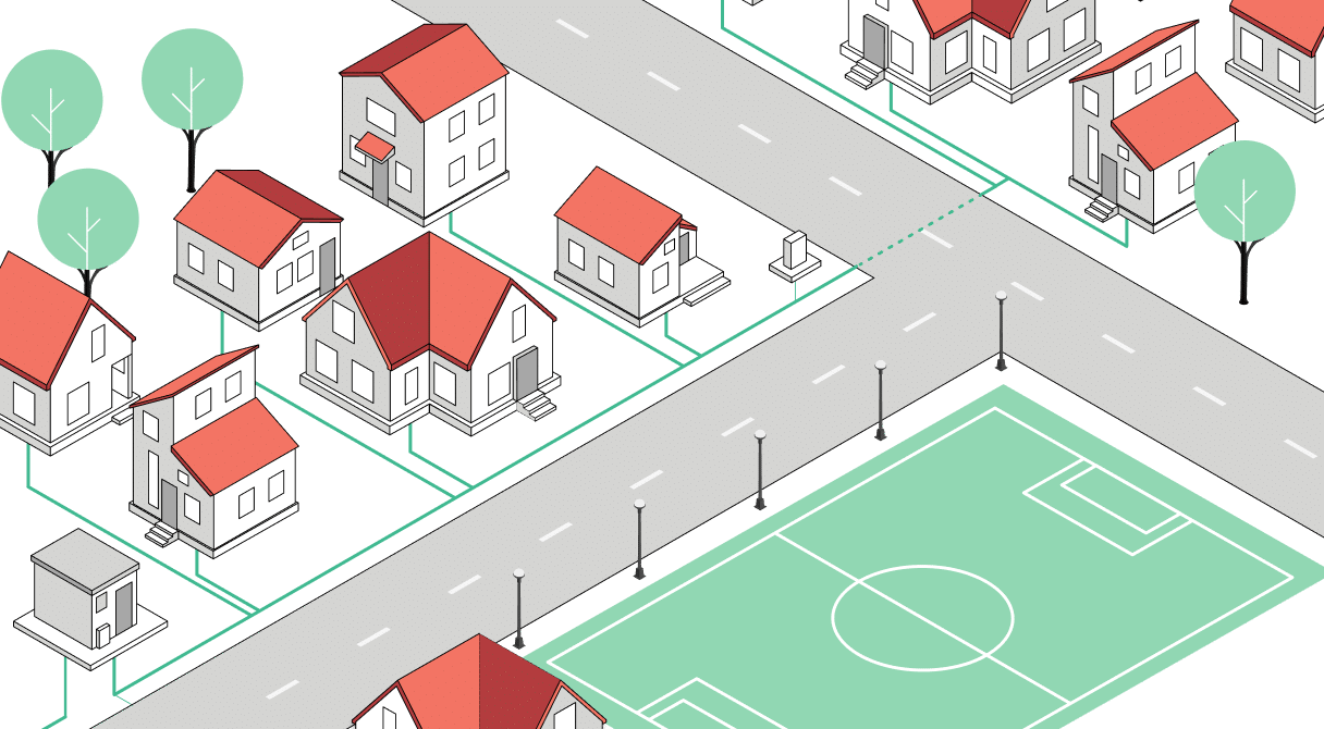 Moderne Glasfaserinfrastruktur in einem Wohngebiet mit Straßen und einem Fußballfeld für schnelle Internetverbindungen.
